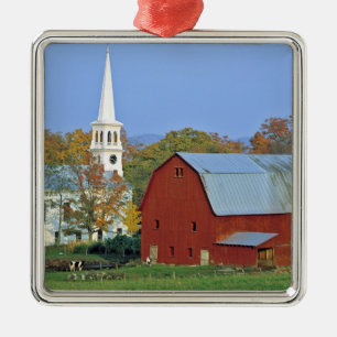 USA, Vermont, Peacham. A red barn and white Metal Ornament