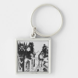 Using a bow at the gate of Yven Keychain