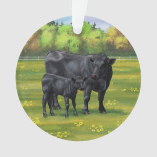 Vache d'Angus noir et veau mou en pâturage d'été