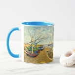 Van Gogh Fishing Boats on Beach at Saintes Maries Mug<br><div class="desc">Fishing Boats on the Beach at Saintes Maries by Vincent van Gogh is a vintage fine art post impressionism maritime painting. A nautical seascape ocean scene with several fishing sailboats on a beach in France overlooking the sea with more boats sailing. About the artist: Vincent Willem van Gogh (1853 -1890)...</div>