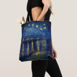 Van Gogh - Starry Night Over The Rhone Shopping Tote Bag<br><div class="desc">Van Gogh's Art Work - "Starry Night Over The Rhone" is featured on this tote. Beautiful night effects in this view of the Rhône in which Van Gogh marvellously transcribed the colours he perceived in the dark. Blues prevail: Prussian blue, ultramarine, and cobalt. The city gas lights glimmer an intense...</div>