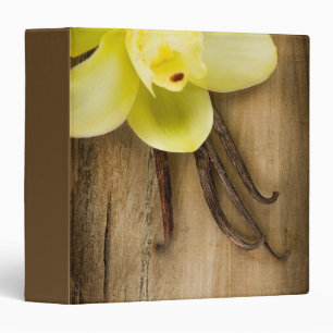 Vanilla Pods and Flower over Wooden Background Binder