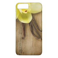 Vanilla Pods and Flower over Wooden Background