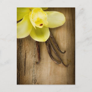 Vanilla Pods and Flower over Wooden Background Postcard