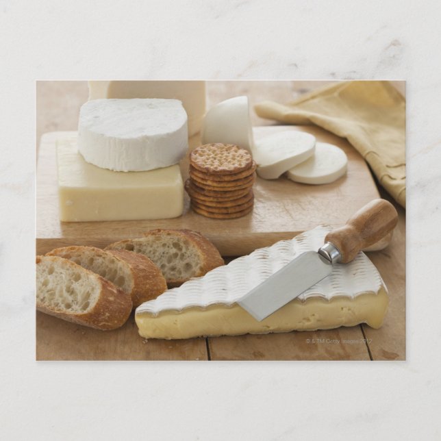 Various cheeses and bread on table postcard (Front)