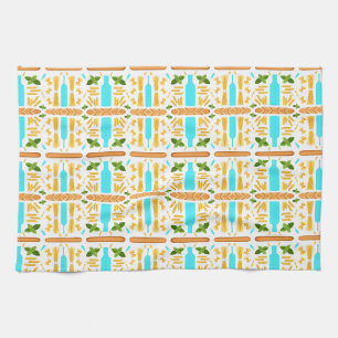 Various dry pasta shapes basil and baguettes kitchen towel