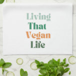 Vegan Phrase, Living That Vegan Life Kitchen Towel<br><div class="desc">Embrace your vegan lifestyle with this trendy , minimalist kitchen towel! Featuring the phrase "Living That Vegan Life" in a stylish, simple green and orange colour palette, this white kitchen towel adds a touch of eco-friendly elegance to your kitchen. Perfect for the eco-conscious cook, it’s a subtle yet cute statement...</div>