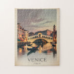 Venice Italy Rialto Bridge Vintage Twilight Rustic Jigsaw Puzzle<br><div class="desc">Bring home a piece of Italy with this vintage-style Venice postcard, featuring the iconic Rialto Bridge glowing at twilight. Elegant gondolas drift along the Grand Canal, surrounded by softly lit Venetian buildings and dreamy, swirling clouds that add a romantic, ethereal mood. Designed with a rustic torn-paper border and aged parchment...</div>