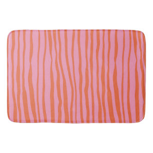 Vertical retro wavy lines - pastel orange and pink bath mat