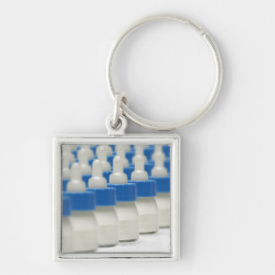 Very small feeding bottles in perspective, shot keychain