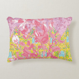 Vibrant fabric pattern featuring pink, yellow, and accent pillow