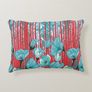 Vibrant floral pattern with turquoise flowers, red accent pillow