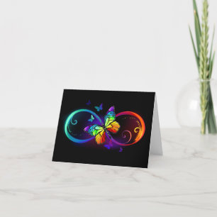 Vibrant infinity with rainbow butterfly on black holiday card