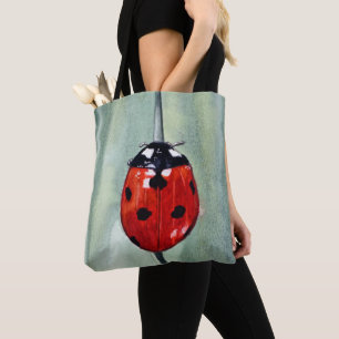Vibrant ladybug on green background, watercolor tote bag