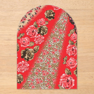 Vibrant red fabric featuring intricate floral and  acrylic invitations