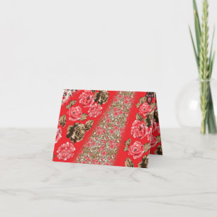 Vibrant red fabric featuring intricate floral and card