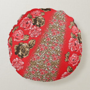 Vibrant red fabric featuring intricate floral and round pillow