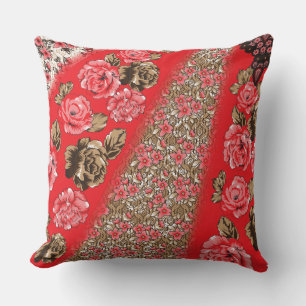 Vibrant red fabric featuring intricate floral and throw pillow