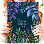 Vibrant Tropical Floral Custom Name Planner<br><div class="desc">This vibrant design showcases a lush tropical floral arrangement with colourful foliage and berries in shades of purple, orange, green, and blue, set against a deep navy background. The personalized name and year add a stylish and unique touch, making it perfect for nature lovers, students, or professionals. Ideal for organizing...</div>