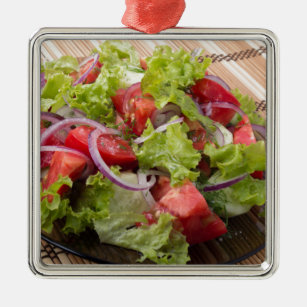 View angle on a fragment of vegetarian salad metal ornament