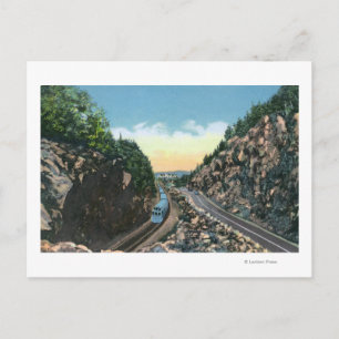 View of a Train Alongside the Highway Postcard