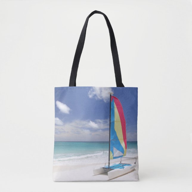 View Of Beach With Sailboat Tote Bag (Front)