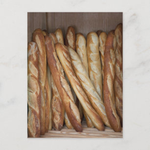 view of bread loaves in bakery window display postcard