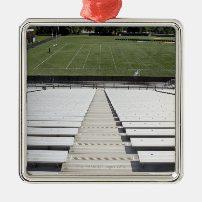View of football field from empty bleachers metal ornament (Front)