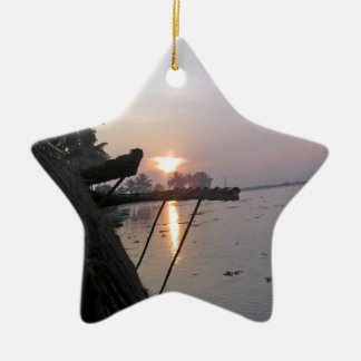 View of sunrise from a houseboat window ceramic ornament