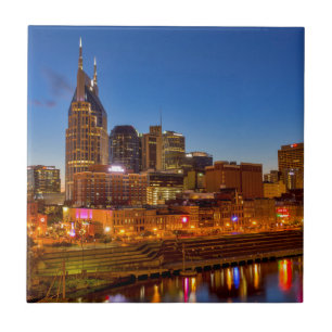 View of the city skyline at dusk tile