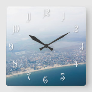View on the seacoast through the airplane window square wall clock