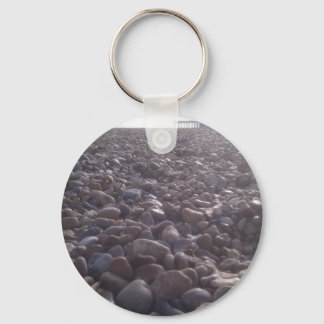 View over pebbles to silouetted West Pier Keychain