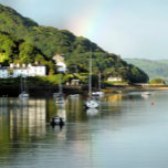 VIEWS OF WALES KITCHEN TOWEL<br><div class="desc">After a day of rain,  the sun finally comes out and a rainbow appears in the sky,  in this beautiful landscape from Aberdyfi harbour in Wales,  with boats in the water and some of the village houses.</div>
