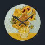 Vincent Van Gogh 12 Sunflowers Impressionist Round Clock<br><div class="desc">Vincent Van Gogh's Vase with 12 Sunflowers is one of Van Gogh's famous Sunflower series. This painting of sunflowers is part of Van Gogh's second set of beautiful impressionist sunflower paintings, which he created in 1888. The sunflowers are yellow against a background of light blue. As in all of Van...</div>