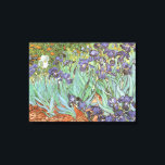 Vincent van Gogh - Irises Canvas Print<br><div class="desc">Irises (1889) by Van Gogh is a vintage post impressionism fine art floral nature painting. A group of purple bearded irises and a single white iris flower growing in a garden. It was one of his first paintings while he was at the asylum in Saint-Remy-de-Provence. In 1987 it became the...</div>