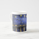 Vincent Van Gogh Starry Night Over The Rhone Bone China Mug<br><div class="desc">Vincent Van Gogh Starry Night Over the Rhone Starry Night Over the Rhone (September 1888) is one of Vincent van Gogh's paintings of Arles at night time in Arles. It was painted at a spot on the bank of the Rhone River that was only a one or two-minute walk from...</div>