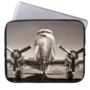 vintage airplane on a runway laptop sleeve