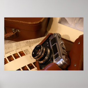 Vintage analogue camera in leather brown case poster