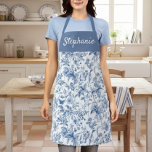 Vintage Blue Floral Toile Monogram Apron<br><div class="desc">Elevate your kitchen style with this gorgeous blue floral apron, personalized just for you! Featuring a timeless blue and white toile-style botanical pattern that evokes classic elegance, this apron is as beautiful as it is functional. The rich blue chest panel is customized with a graceful script, making it a perfect...</div>