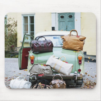 Vintage car with lots of luggage mouse pad