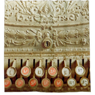 Vintage cash register, covered in dust and cobweb