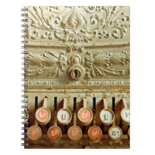 Vintage cash register, covered in dust and cobweb notebook