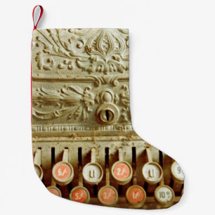 Vintage cash register,  covered in dust and cobweb small christmas stocking