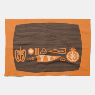 Vintage chopping board and orange veg, tea towel