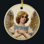 Vintage Christmas Angel Ivory Holiday Message  Ceramic Ornament<br><div class="desc">This beautiful vintage Christmas angel has gold wings and pale blue and gold robes. She is placed on an ivory background. Personalize the back with your own message.</div>