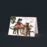 Vintage Christmas card<br><div class="desc">What a sweet vintage Christmas card this is!  Two cute cats at the market place on Christmas.  A black cat with a red bandana tied around his neck makes a trade with a brown and ginger striped cat.  The card read "Loving Christmas Wishes".</div>