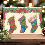 Vintage Christmas Stockings Holiday Postcard<br><div class="desc">Beautiful vintage Christmas stocking postcard. This design features three decorative stockings with a holly garland.</div>