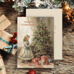 Vintage Christmas Tree Girl Gifts Holiday Card<br><div class="desc">Christmas greeting card with a vintage painting of a girl decorating a Christmas tree with wrapped gifts underneath. Text says, "Merry Christmas" but is customizable for your own greeting. Personalized on the back with your message and name. Contact me for assistance with your customization or to request additional matching or...</div>
