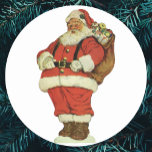 Vintage Christmas, Victorian Santa Claus with Toys Classic Round Sticker<br><div class="desc">Vintage illustration Merry Christmas holiday image featuring a jolly Santa Claus carrying dolls and toys in a sack. Antique Victorian die cut.</div>