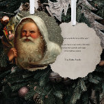 Vintage Father Christmas in Snow with Toys Ornament Card<br><div class="desc">Artistic vintage Robert Finlay McIntyre portrait of white-robed Father Christmas carrying a sack of toys in the snow. Back features complementary sepia background with editable text fields.</div>